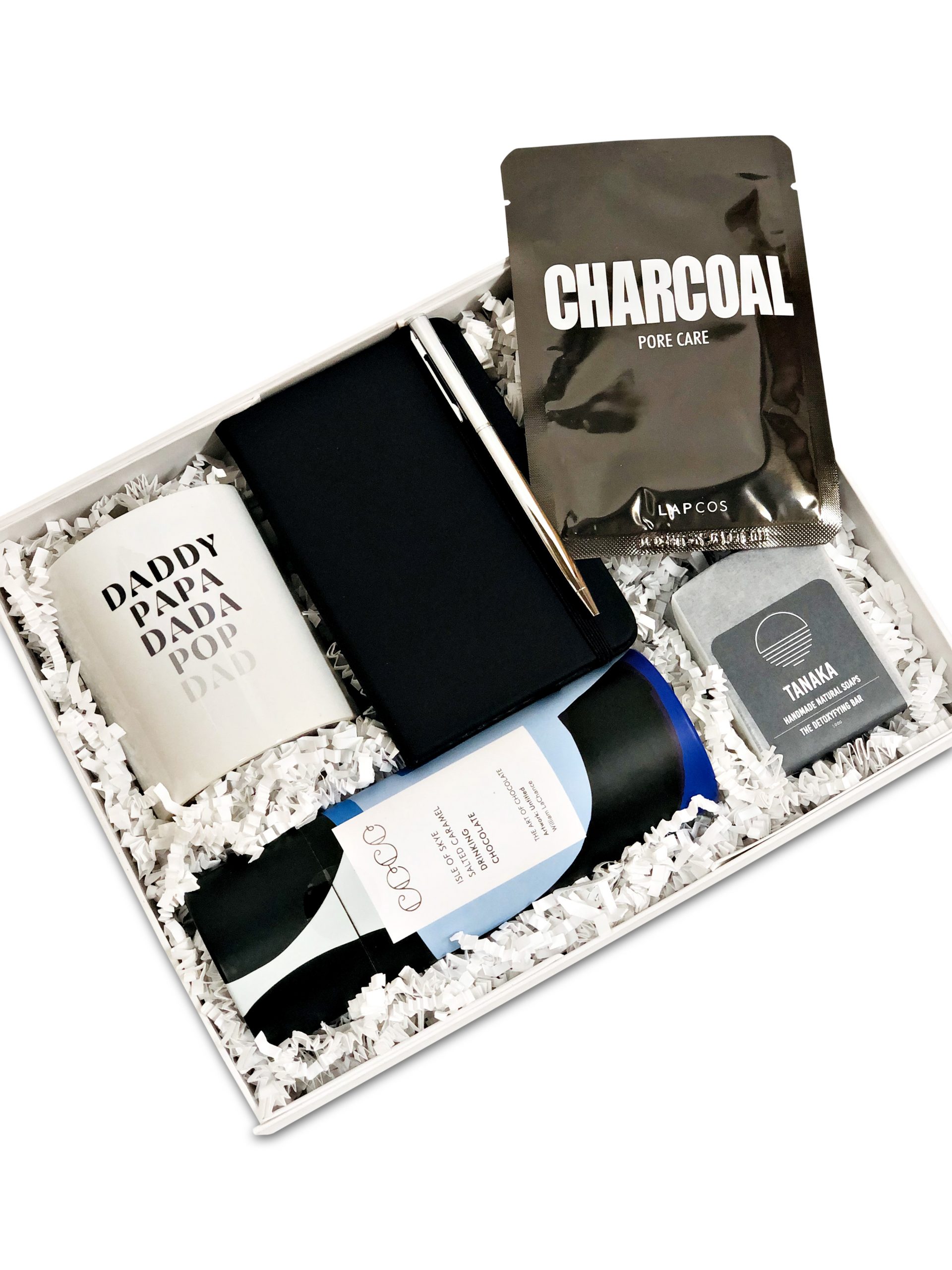 Gift box for guys with a mug for dad, charcoal soap, notebook and pen, face mask and luxury hot chocolate